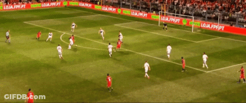 A Group Of Soccer Players On A Field With A Banner That Says Compre Produtos Oficial GIF