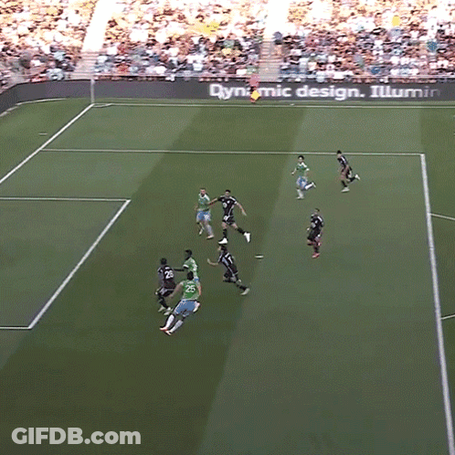 A Group Of Soccer Players On A Field With A Dynamic Design Sign In The Background GIF