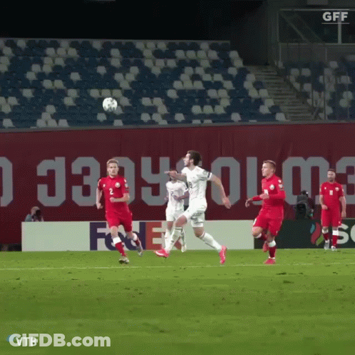 A Group Of Soccer Players On A Field With A Gff Sign In The Background GIF