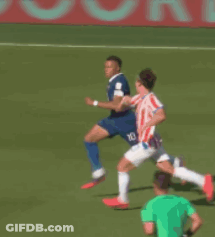 A Group Of Soccer Players On A Field With A Red And White Banner In The Background GIF