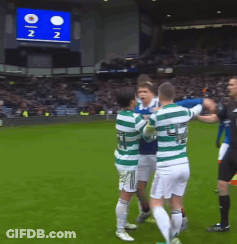 A Group Of Soccer Players On A Field With A Scoreboard In The Background That Says 2 2 GIF