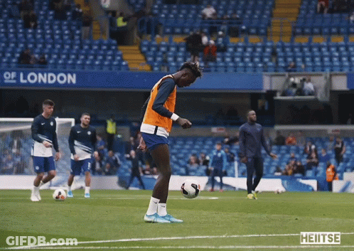 A Group Of Soccer Players On A Field With A Sign That Says London GIF