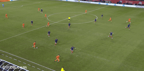 A Group Of Soccer Players On A Field With An Ad For Continental On The Sidelines GIF