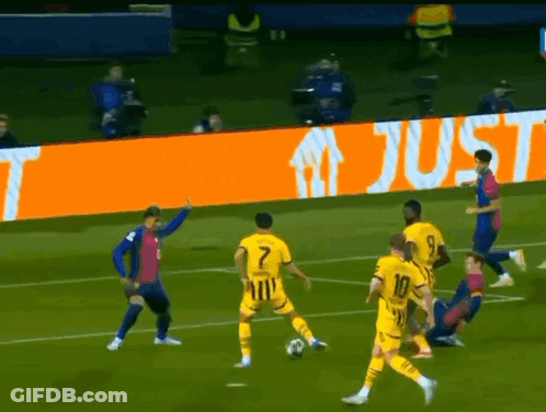 A Group Of Soccer Players On A Field With An Orange Sign That Says Just In The Background GIF