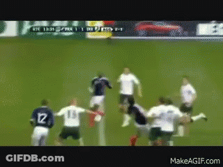 A Group Of Soccer Players On A Field With One Wearing Number 12 GIF