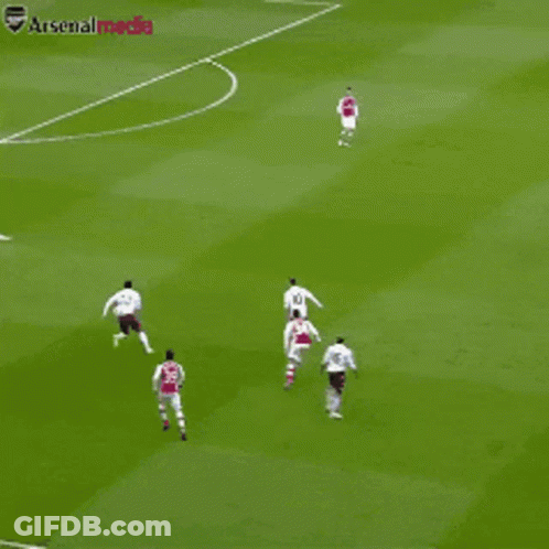 A Group Of Soccer Players On A Field With The Word Arsenal Visible GIF