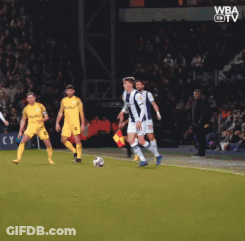 A Group Of Soccer Players On A Field With The Word Wba On The Bottom Left GIF