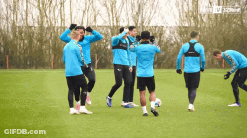 A Group Of Soccer Players On A Field With The Words 32Red On The Bottom Left GIF