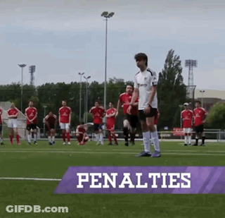 A Group Of Soccer Players Standing On A Field With The Word Penalties On The Bottom GIF