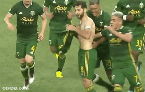A Group Of Soccer Players Wearing Alaska Airlines Jerseys Are Running On The Field GIF