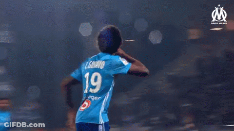 A Group Of Soccer Players Wearing Blue Jerseys With The Number 19 On Them GIF