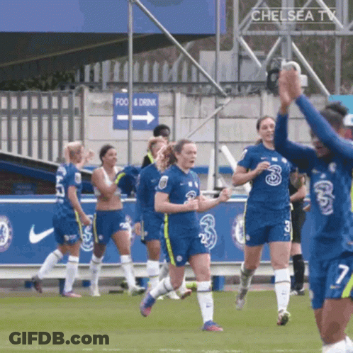 A Group Of Soccer Players Wearing Blue Jerseys With The Number Three On Them GIF