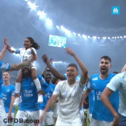 A Group Of Soccer Players Wearing Blue Uber Eats Jerseys GIF