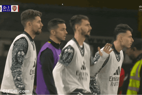 A Group Of Soccer Players Wearing Emirates Fly Emirates Vests GIF