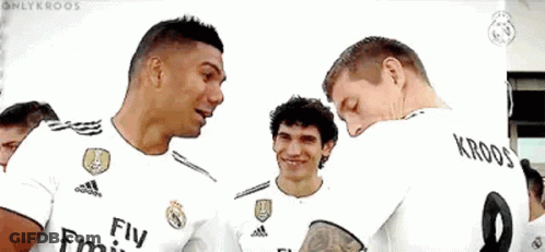 A Group Of Soccer Players Wearing Fly Emirates Jerseys Are Standing Next To Each Other And Smiling . GIF