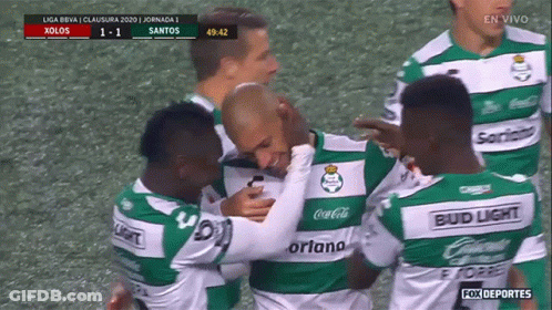 A Group Of Soccer Players Wearing Green And White Jerseys Sponsored By Bud Light GIF