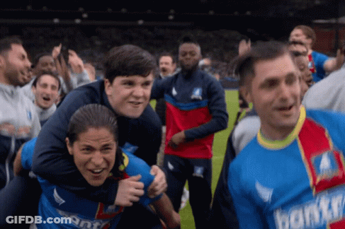 A Group Of Soccer Players Wearing Jerseys That Say Donkey Are Celebrating GIF