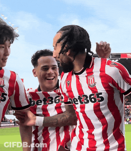 A Group Of Soccer Players Wearing Red And White Striped Jerseys With Bet365 Written On The Front GIF