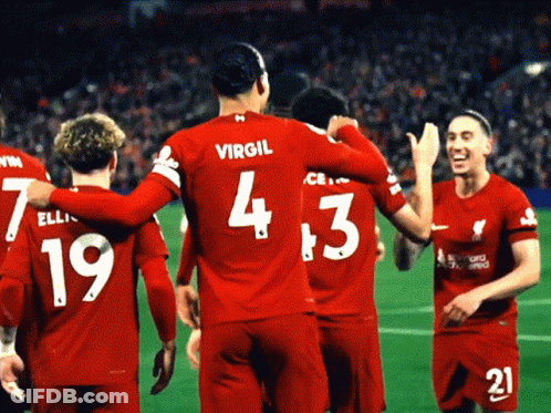 A Group Of Soccer Players Wearing Red Jerseys With The Number 4 And 3 On Them GIF