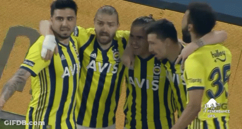 A Group Of Soccer Players Wearing Yellow And Black Striped Jerseys With Avis On The Front GIF
