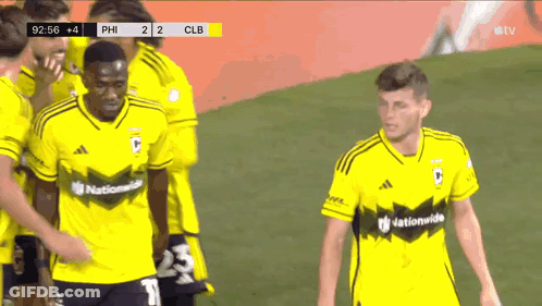 A Group Of Soccer Players Wearing Yellow Jerseys That Say Nationalwide On Them GIF