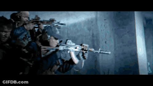 A Group Of Soldiers Are Holding Guns In A Dark Room And One Of Them Is Wearing A Hat That Says Army GIF
