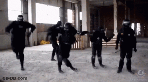 A Group Of Soldiers Are Holding Hands In A Room With A Watermark That Says ' Sns ' GIF
