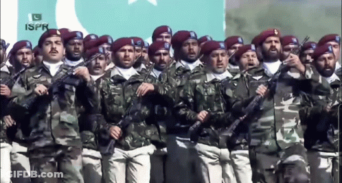 A Group Of Soldiers Are Marching In Front Of A Flag That Says ' Ispr ' On It GIF