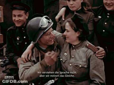 A Group Of Soldiers Are Posing For A Picture And One Of Them Is Wearing A Helmet GIF