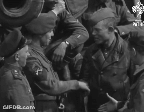 A Group Of Soldiers Are Shaking Hands And The Word Pathe Is On The Bottom GIF