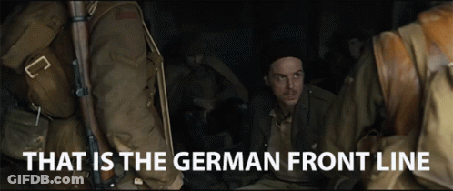 A Group Of Soldiers Are Sitting In A Dark Room With The Words That Is The German Front Line Above Them GIF