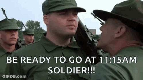 A Group Of Soldiers Are Standing In A Line And One Of Them Is Holding A Gun And Says Be Ready To Go GIF