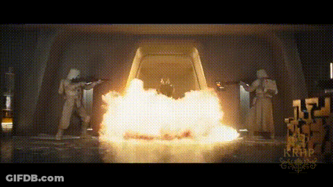 A Group Of Soldiers Are Standing In Front Of A Fire Explosion . GIF