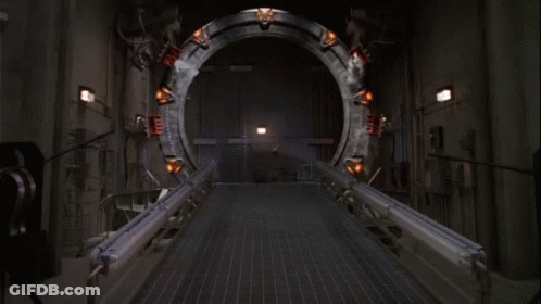 A Group Of Soldiers Are Standing In Front Of A Large Circular Object GIF