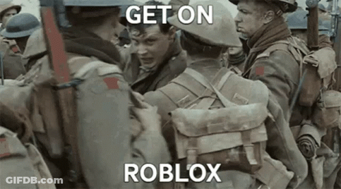 A Group Of Soldiers Are Standing Next To Each Other And One Of Them Is Holding Another Man . GIF