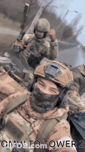 A Group Of Soldiers Are Taking A Selfie With The Words Omw To Tower 2 On The Bottom GIF
