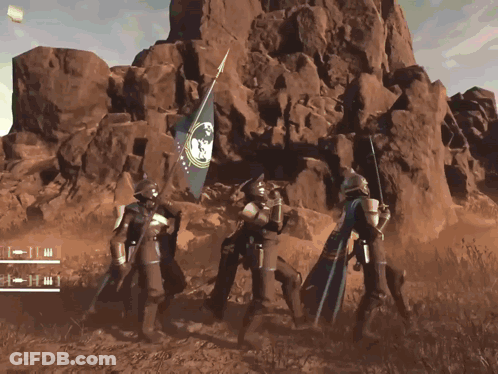 A Group Of Soldiers Holding A Flag In Front Of A Rocky Mountain GIF