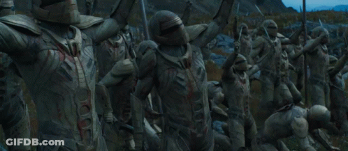 A Group Of Soldiers Holding Flags And Swords GIF