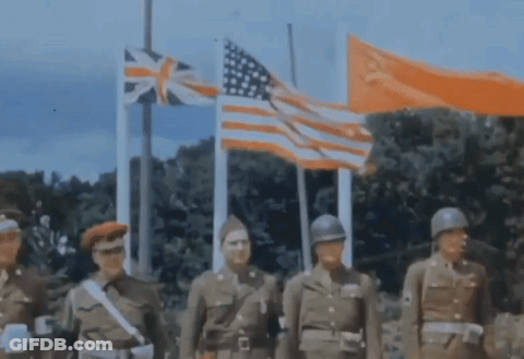 A Group Of Soldiers Standing In Front Of Flags Including The American Flag GIF