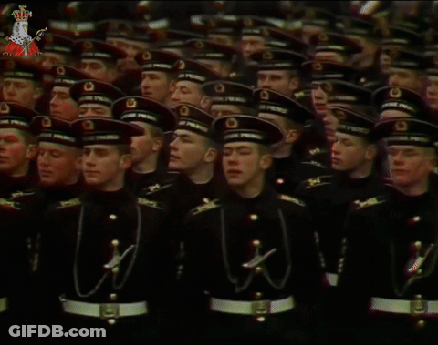 A Group Of Soldiers Wearing Black Uniforms And Hats With The Letters O On Them GIF