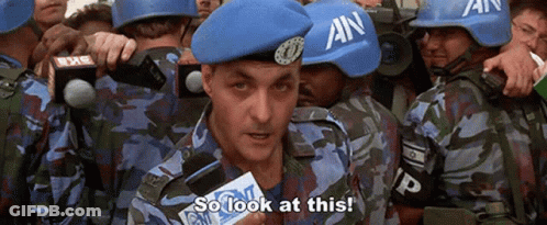 A Group Of Soldiers Wearing Blue Helmets With An On Them GIF