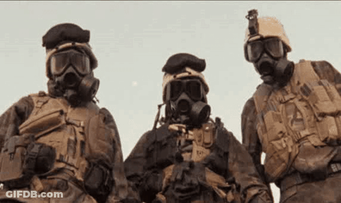 A Group Of Soldiers Wearing Gas Masks And Goggles GIF