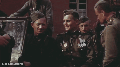A Group Of Soldiers With Medals On Their Uniforms Including One With The Number 6 On It GIF