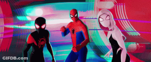 A Group Of Spider-Man Standing Next To Each Other In A Room . GIF