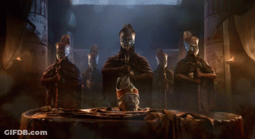 Statues In Dark Room With Central Statue GIF