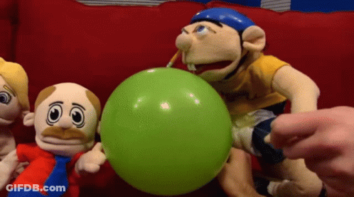 A Group Of Stuffed Animals Are Playing With A Green Balloon GIF