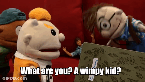 A Group Of Stuffed Animals Are Standing Around A Book That Says " What Are You ? A Wimpy Kid " GIF