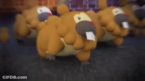 A Group Of Stuffed Animals Are Walking On The Ground . GIF