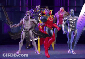 A Group Of Superhero Figures Standing Next To Each Other On A Stage GIF
