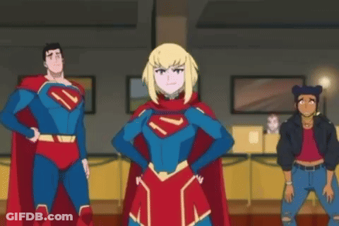 A Group Of Superheroes Are Standing Next To Each Other In A Room Giving Each Other A High Five . GIF